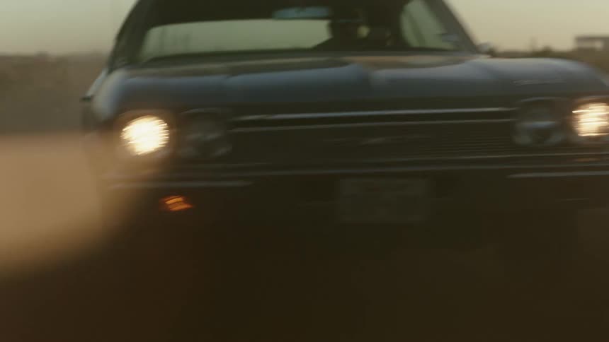 A vehicle is swerving at sunset