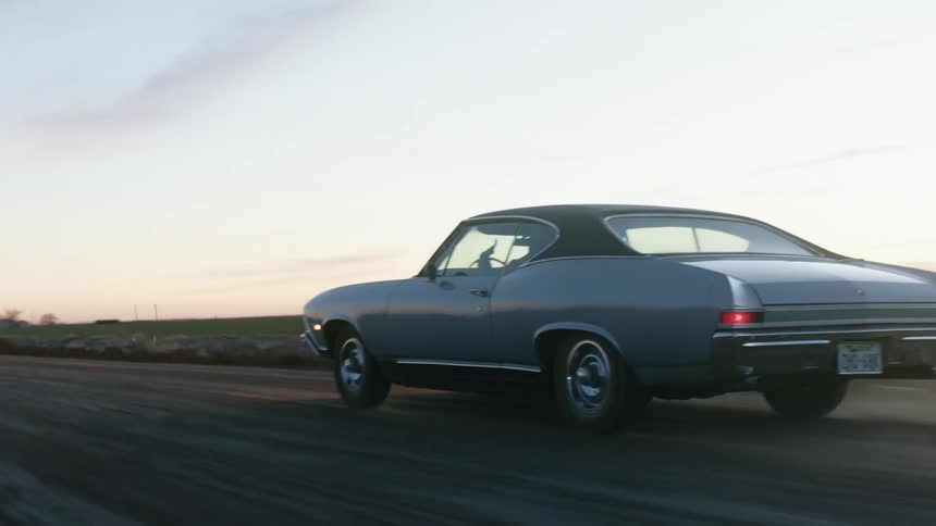 A car driving down a dirt road