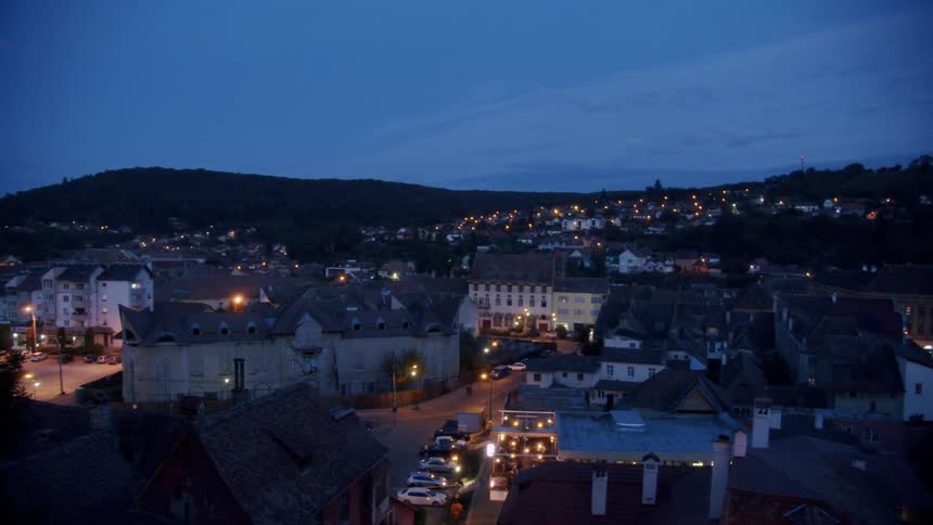 Buildings and lights in a small city at night