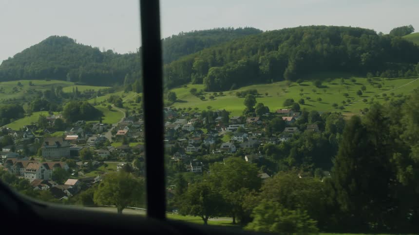 A view from a car of a city in a valley