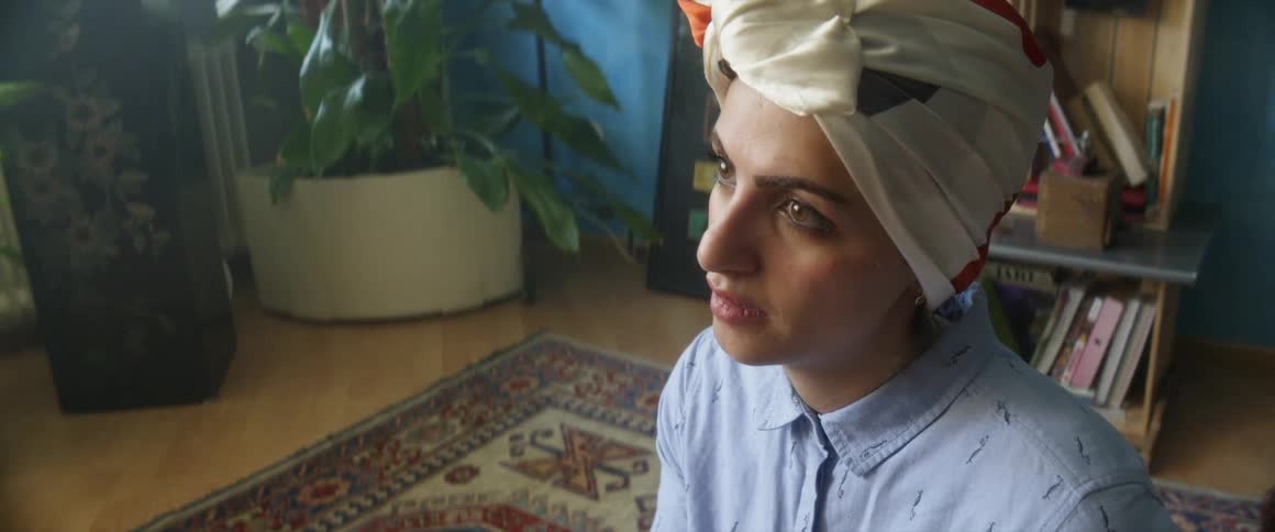 Mother talking about something important to someone else in the room