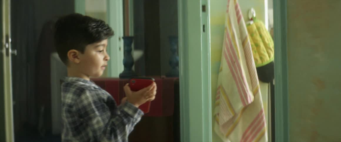 Son talking to someone about something on a phone