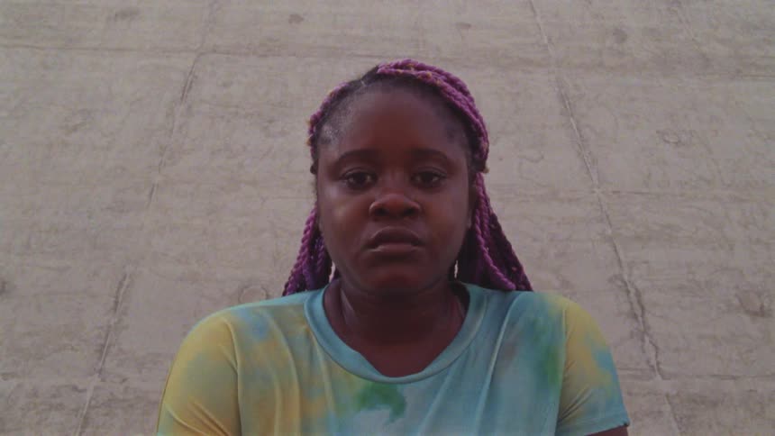 Black woman taking a portrait video