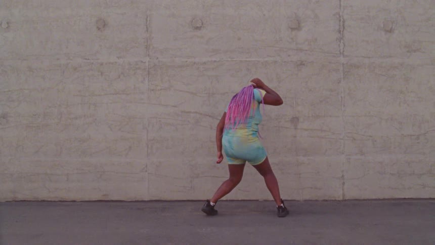 A woman dancing around outside
