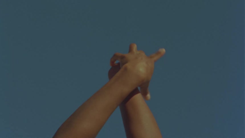 A person that is moving their hands around for a dance