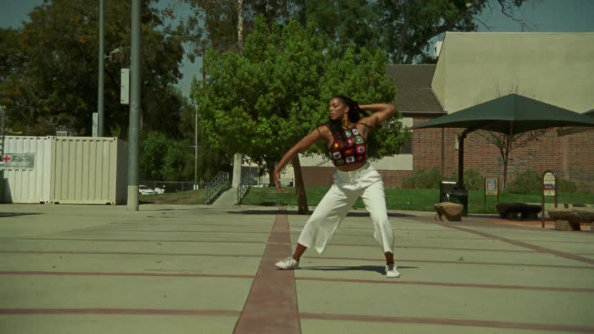 Black woman dancing outdoors
