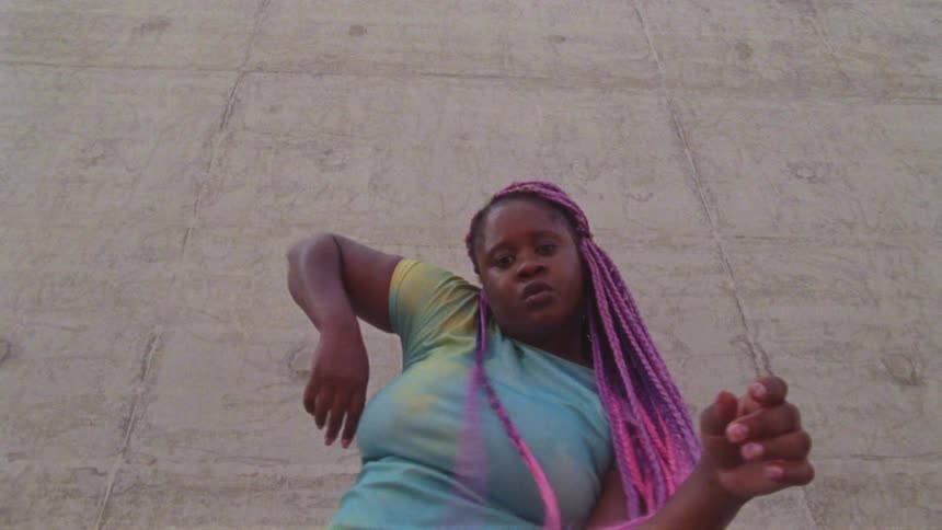 A woman is dancing outside