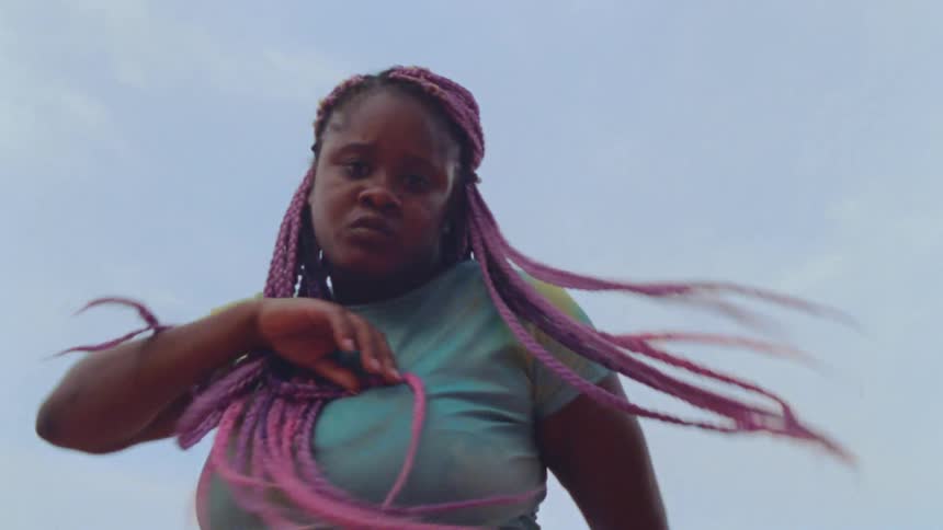 A woman is dancing outside