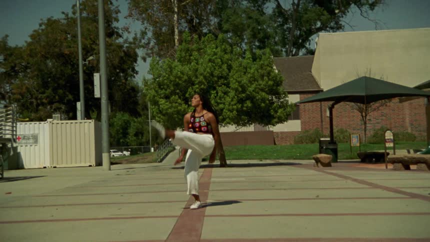 A woman dancing outdoors