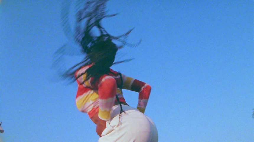 A woman dancing outdoors