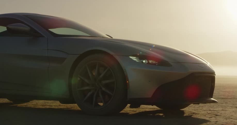 A car is parked outdoors at dusk