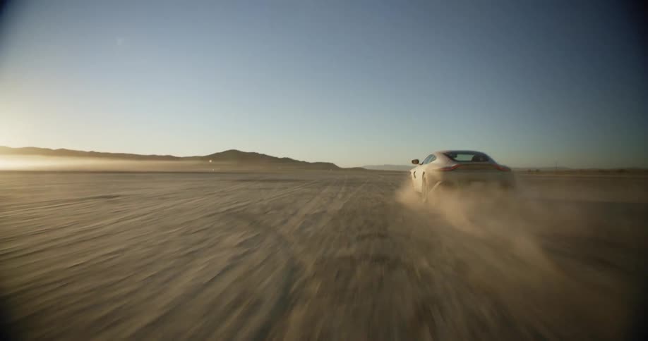 Car driving in desert
