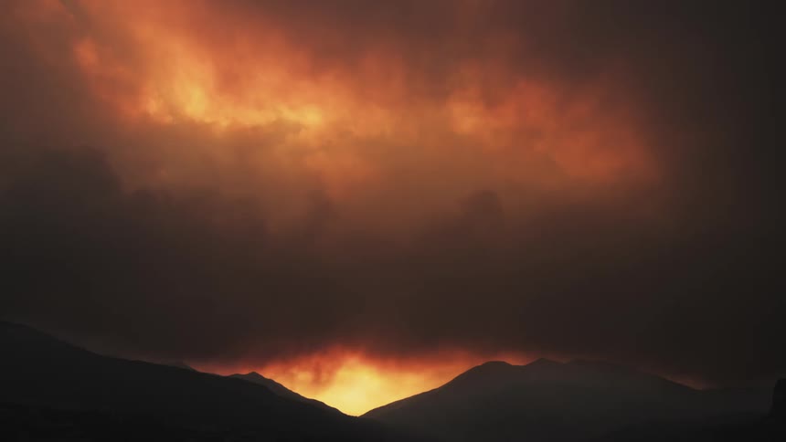 The sun is setting in the horizon in wildfire