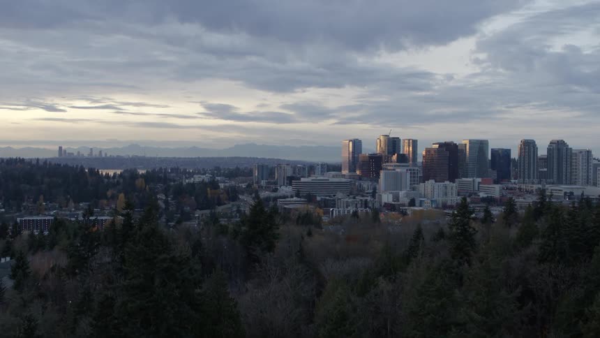 Slow push toward downtown Bellevue with Seattle skyscrapers in the distance