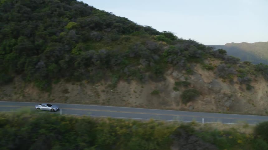 Car driving cliffside