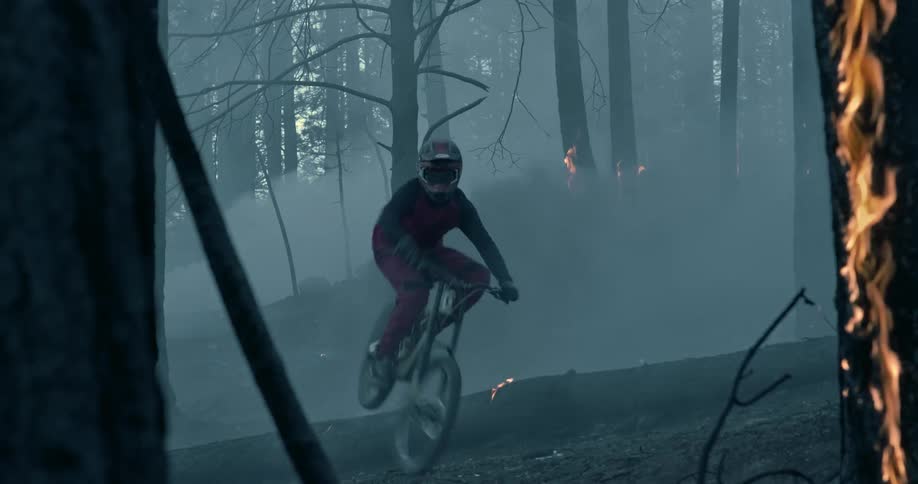Mountain biking in trees on fire