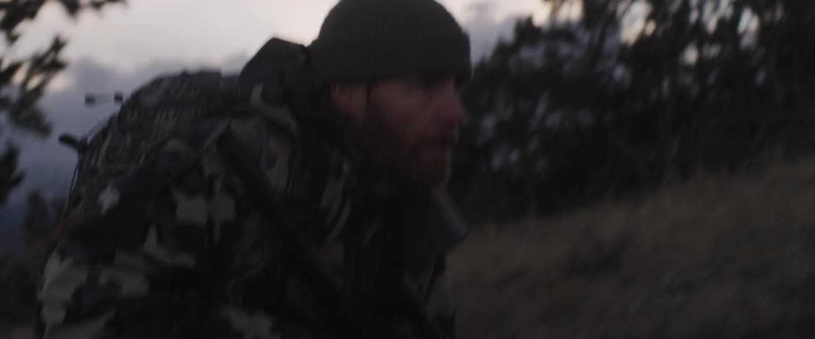 A military man walking up a hill
