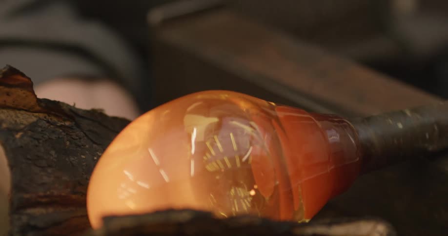 A factory worker doing glass works
