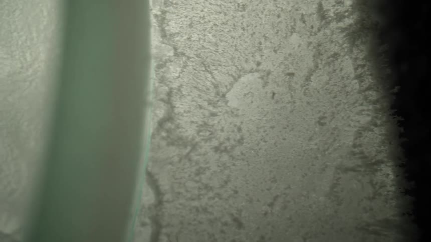 A view of light shining through ice