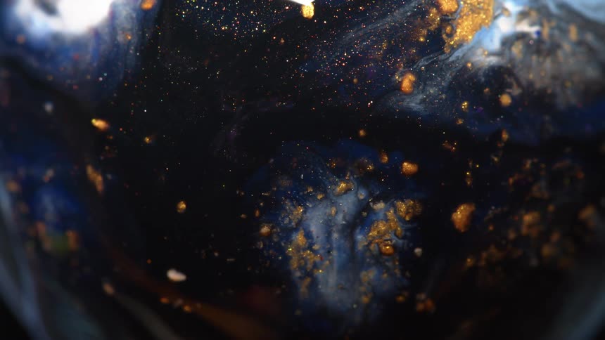 Blue black and gold colors that look like glitter and water