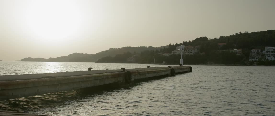 A pier on a lake at dawn