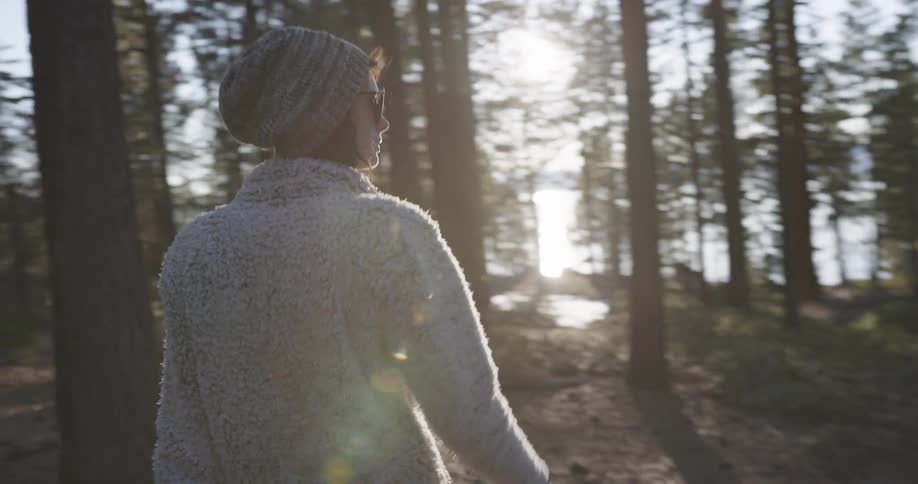 A woman walking in a forest