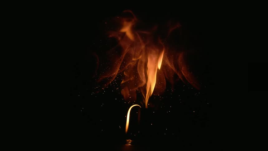 Black orange and gold colors that look like fire in darkness