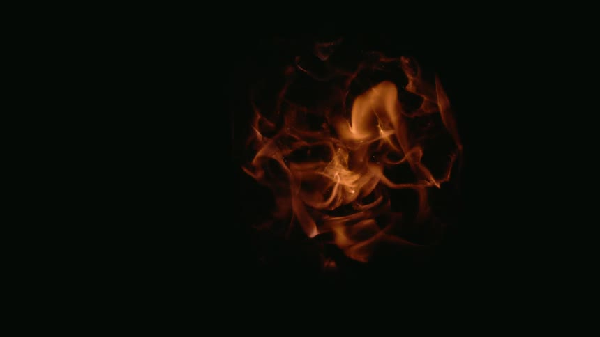 Flames go up and out as a fire breaks out in a clear sphere
