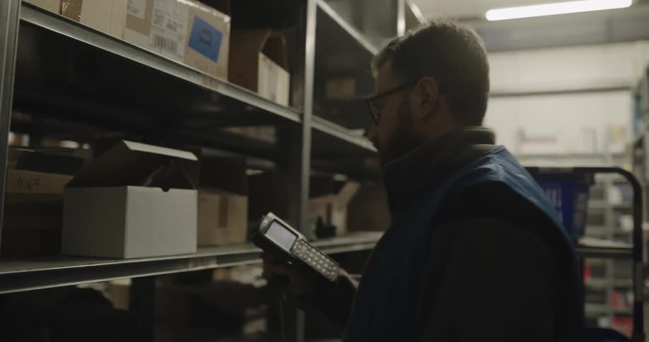 A man is working in a warehouse