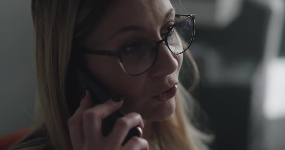 A woman talking to someone on a phone