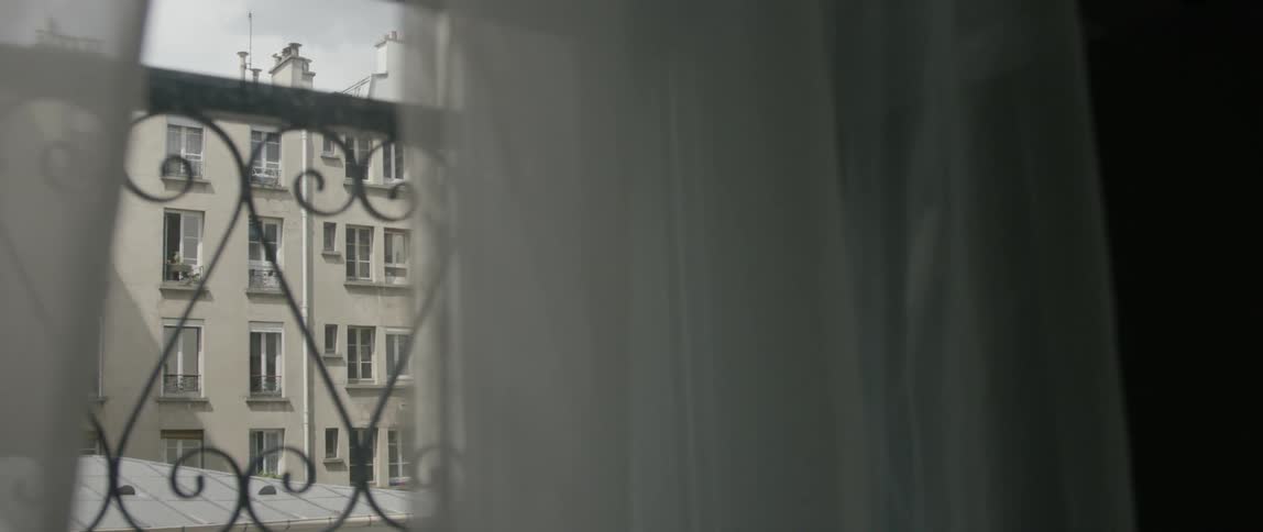 A railing can be seen through this window