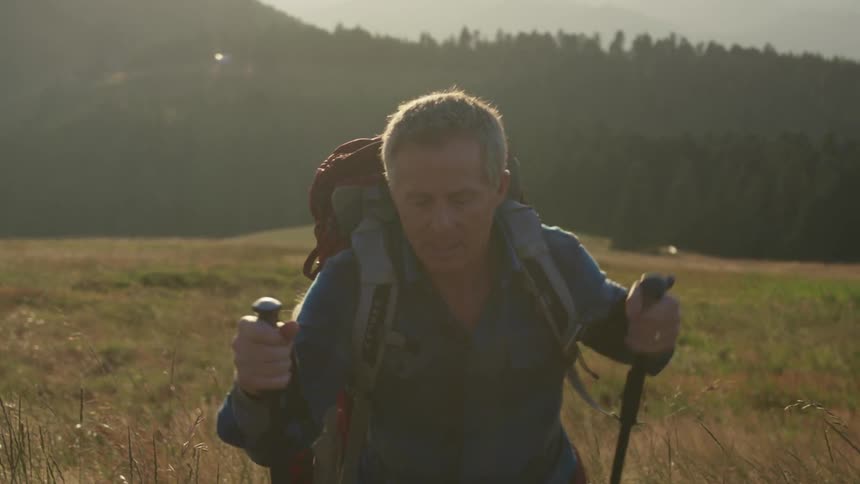A view of people hiking through a field