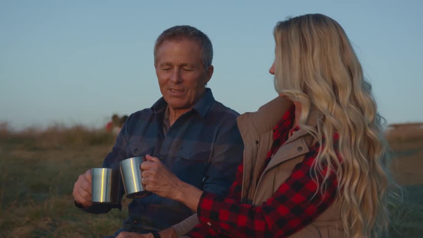 A man and woman drinking coffee together