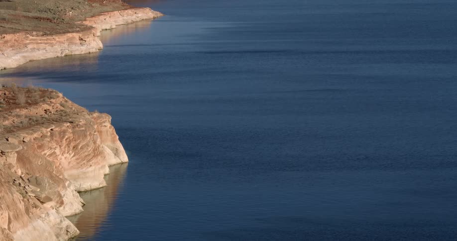 The shore is lined with cliffs