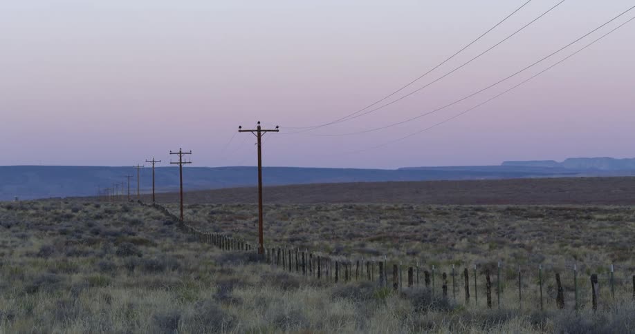 Power lines run through the open prairie