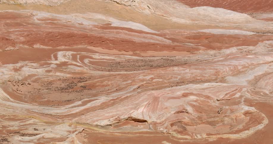 Dirt and rock cover a desert landscape