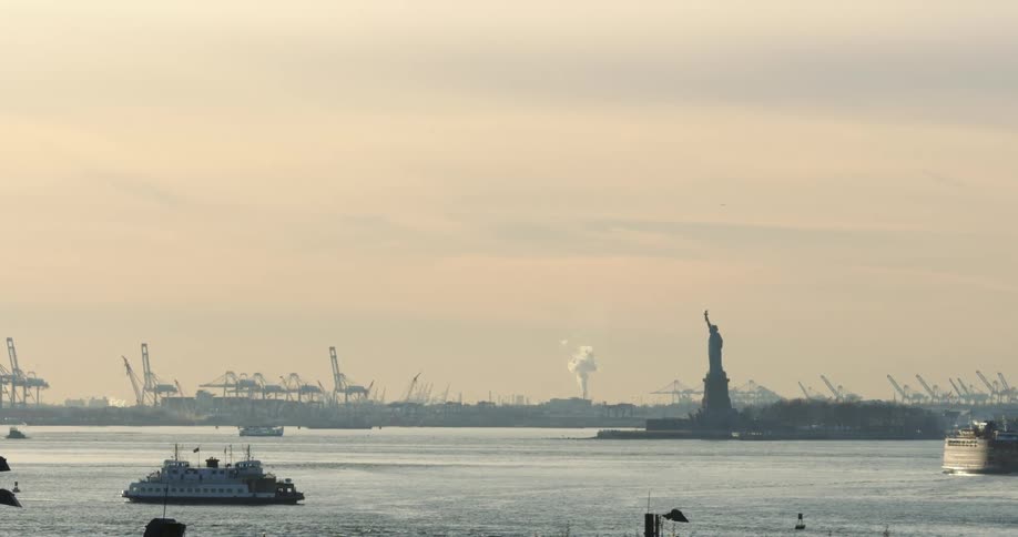 Fog sets over the water near the statue of liberty