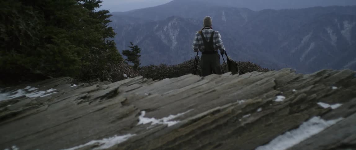 A man hikes alone in mountains