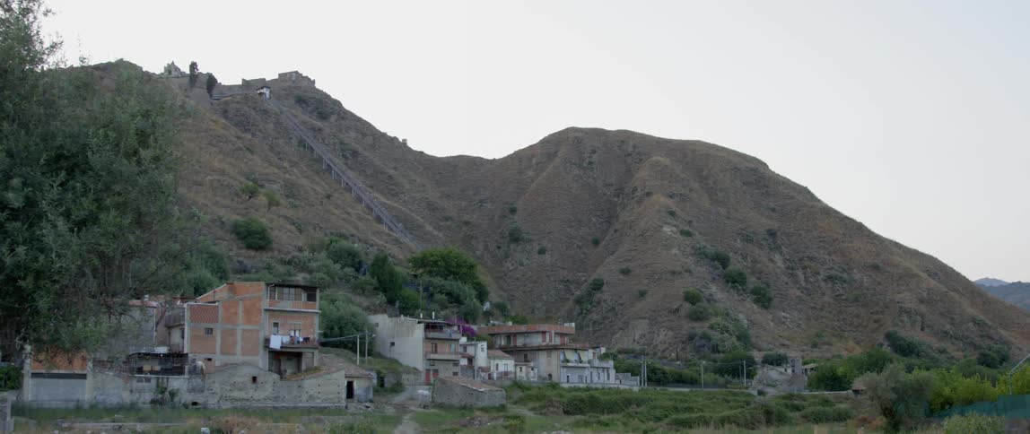 Buildings set at the base of a mountain