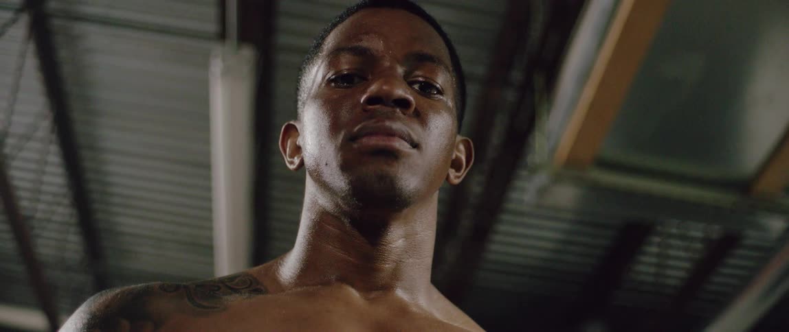 An athlete stares and breathes heavily