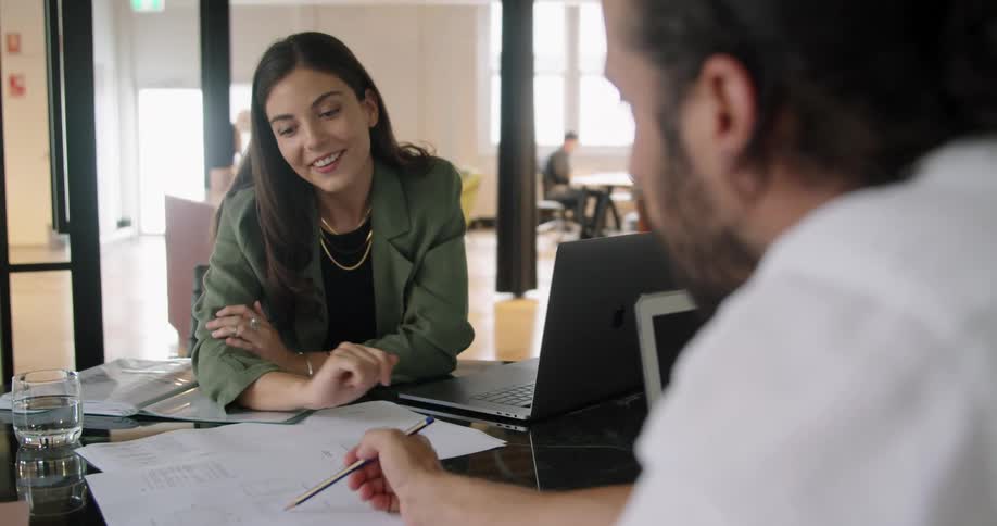 Two workers working at an office