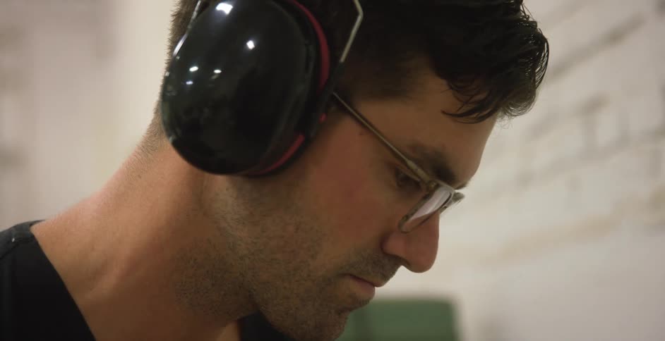 Closeup of man wearing noise cancelling headphones
