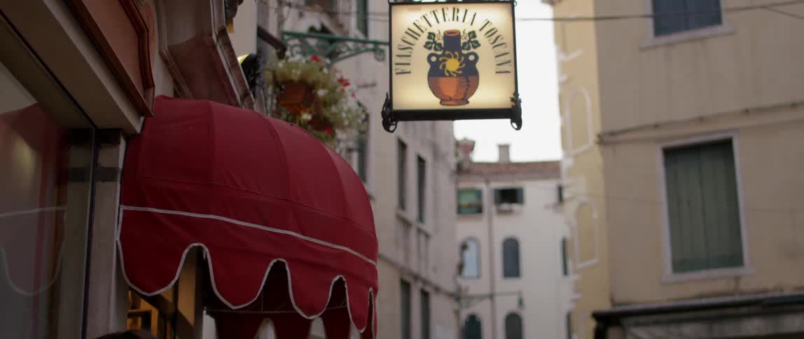 A restaurant sign flickers
