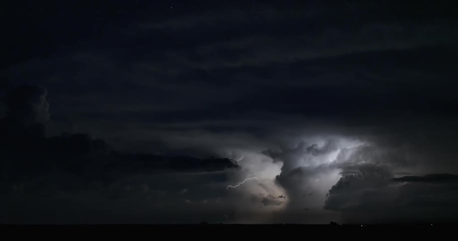 A time lapse shows countless bolts of lightning flashing during a nighttime storm