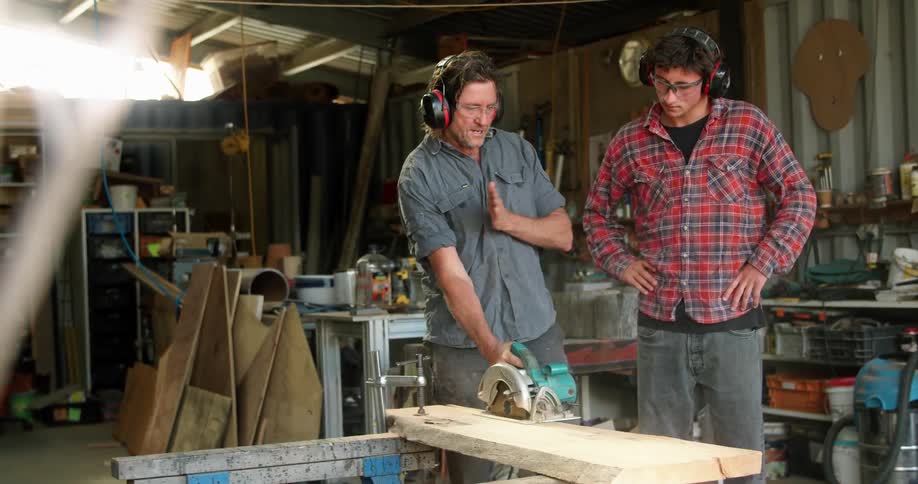 Two workers working in a wood shop