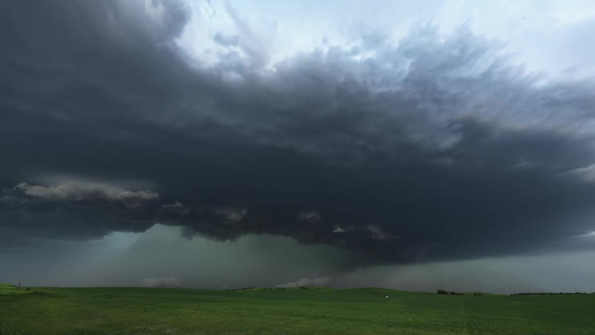 A storm rages over the large field