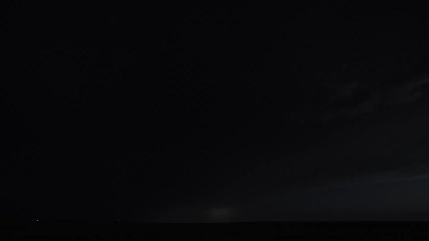 A time lapse shows powerful bolts of lightning flashing to illuminate a nighttime storm