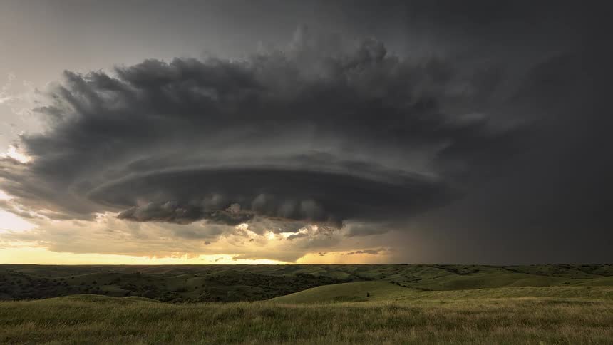 A landscape with lightning storms with the sky and clouds above