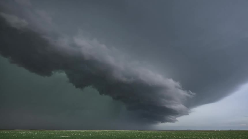 Time lapse of a powerful tornado sweeping across a countryside