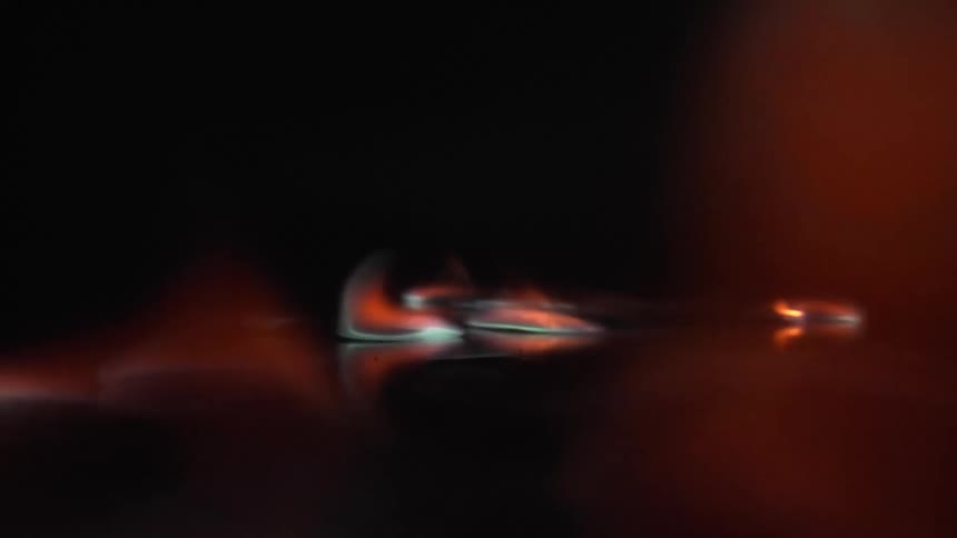 flames dance around and ignite on a black surface